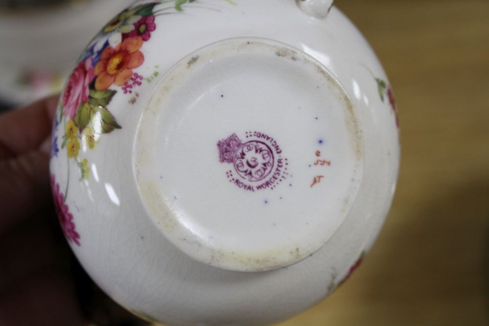 A Royal Worcester part tea service, painted with flower sprays by Ernest Phillips and Ernest Barker,